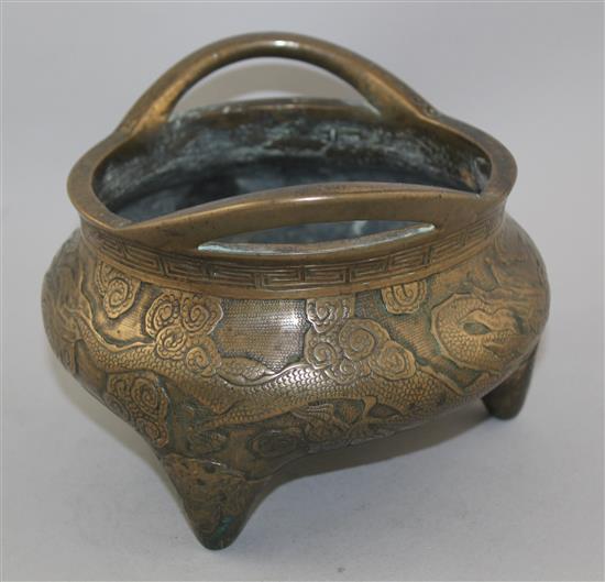 A Chinese bronze tripod censer, Xuande two character mark, 19th century, diam. 18cm, weight 2780g., old repair to base